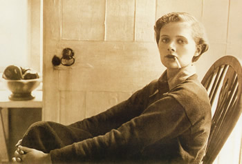 Daphne du Maurier perched on an armchair